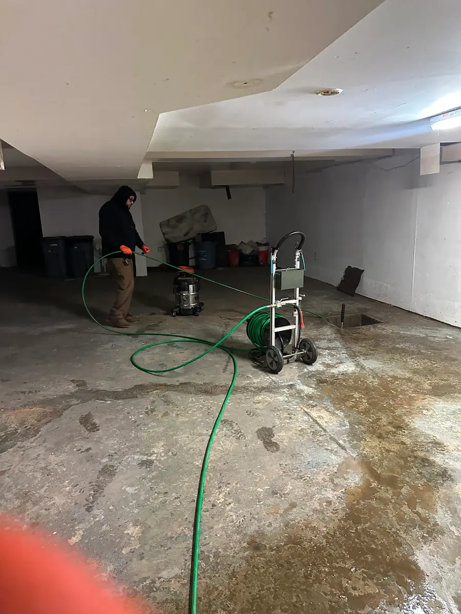 Pumping standing water out of a flooded basement