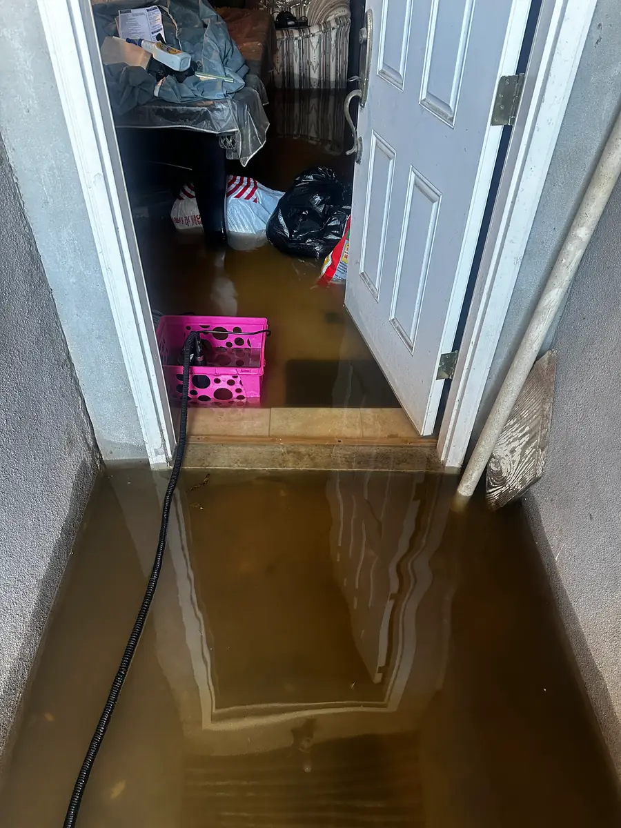 Flooded basement with standing water up to the doorway