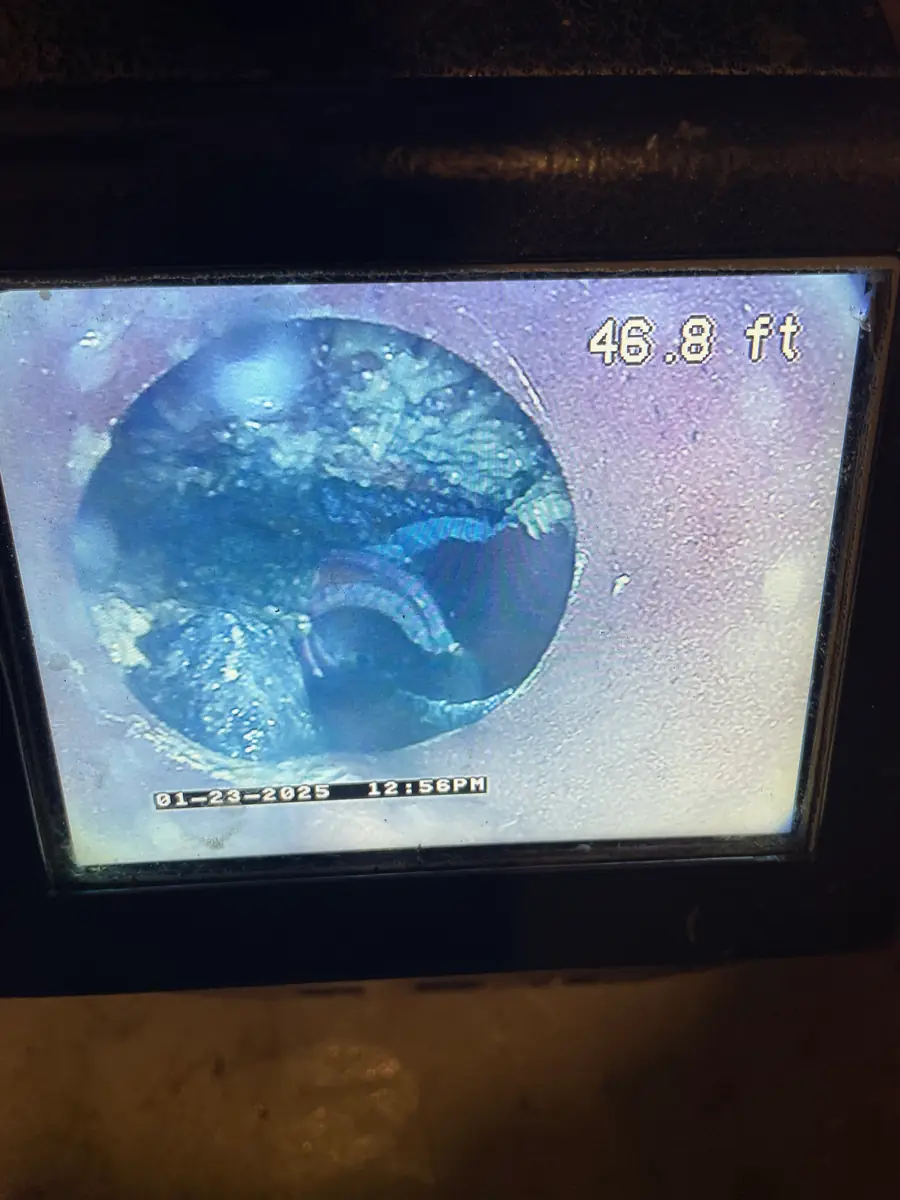 Sewer camera monitor showing the inside of a pipe at 46.8 feet during an inspection